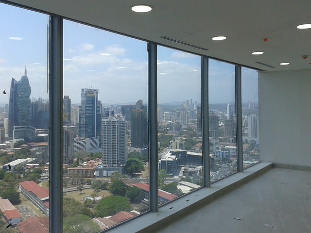 large windows with city view in background