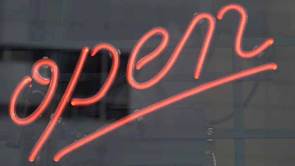 neon open sign inside window