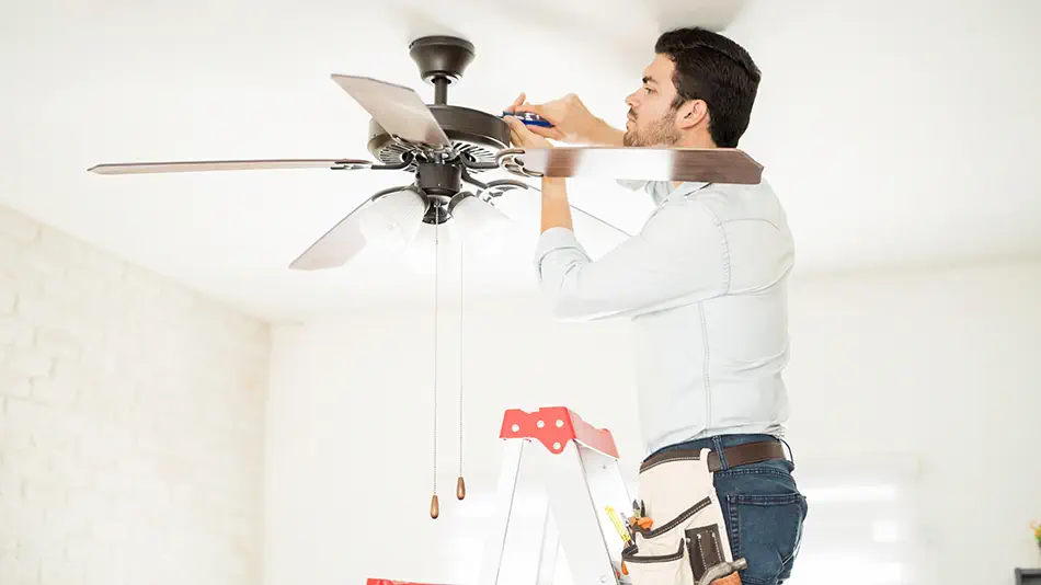 a man installing a smart ceiling fan