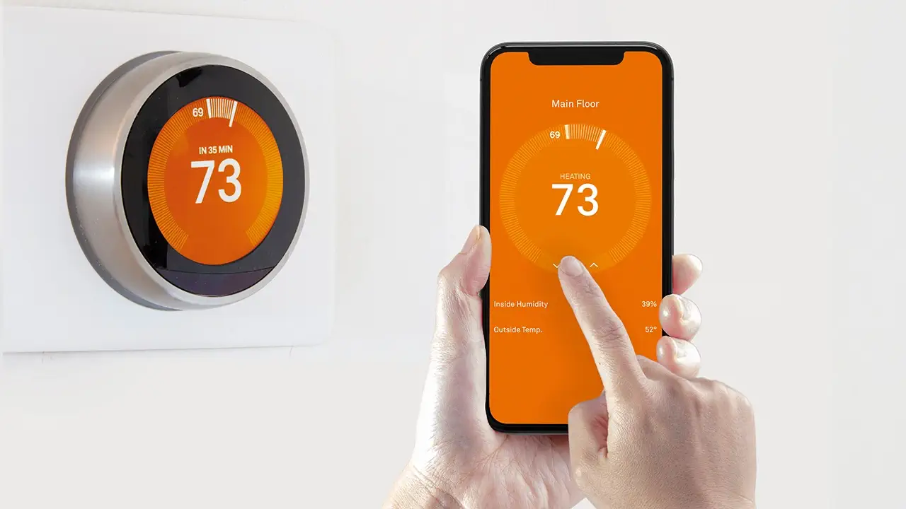 A smartphone is being used to control a smart thermostat in a smart home.