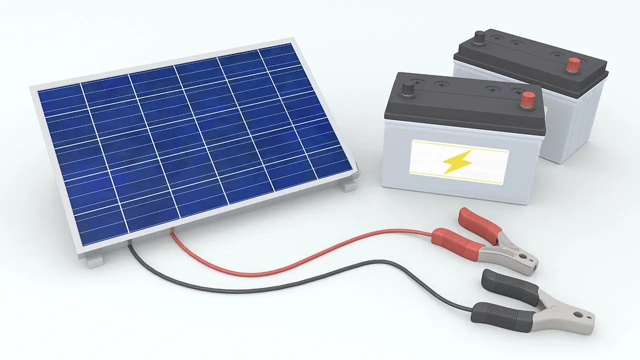 A solar panel with batteries beside it.