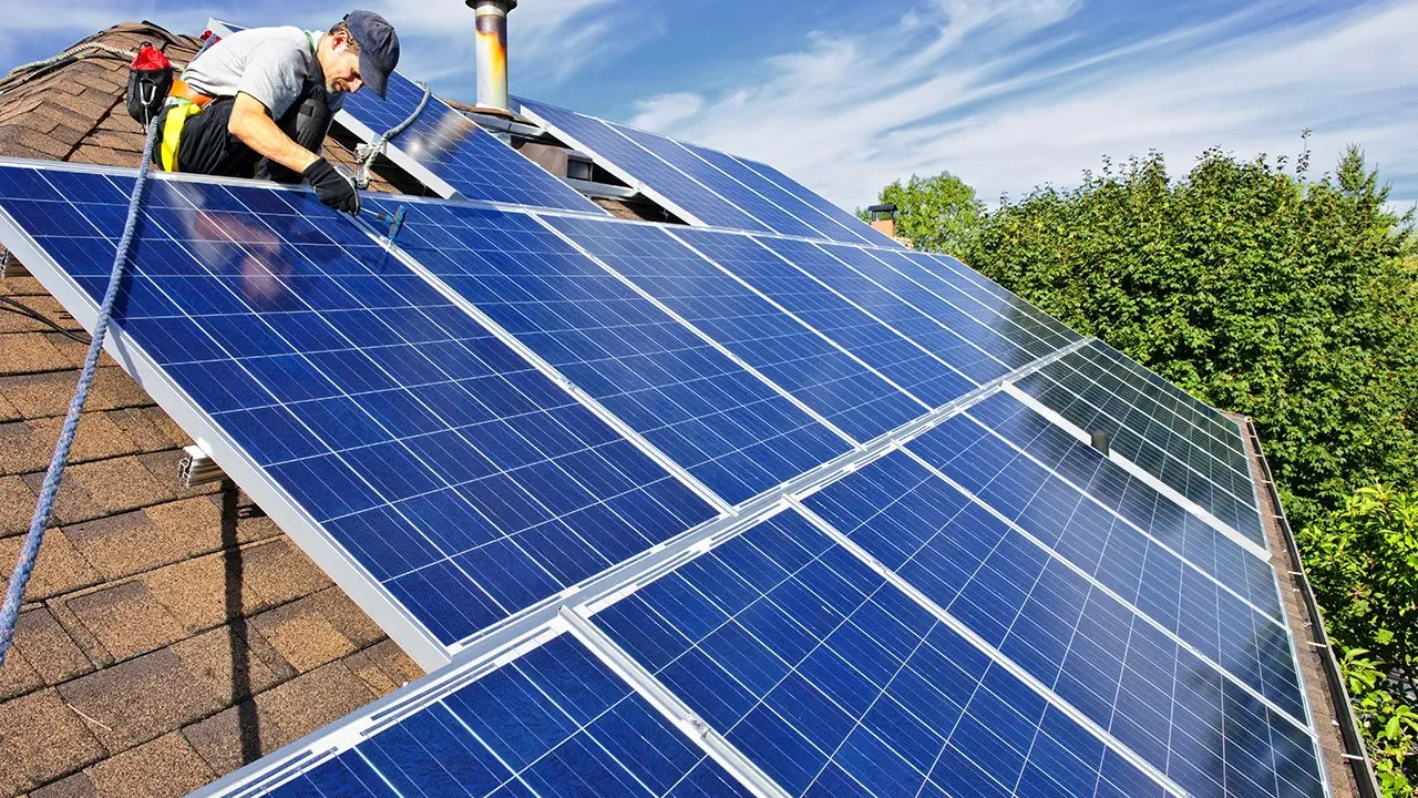 Installation of solar panels on a smart home's roof.